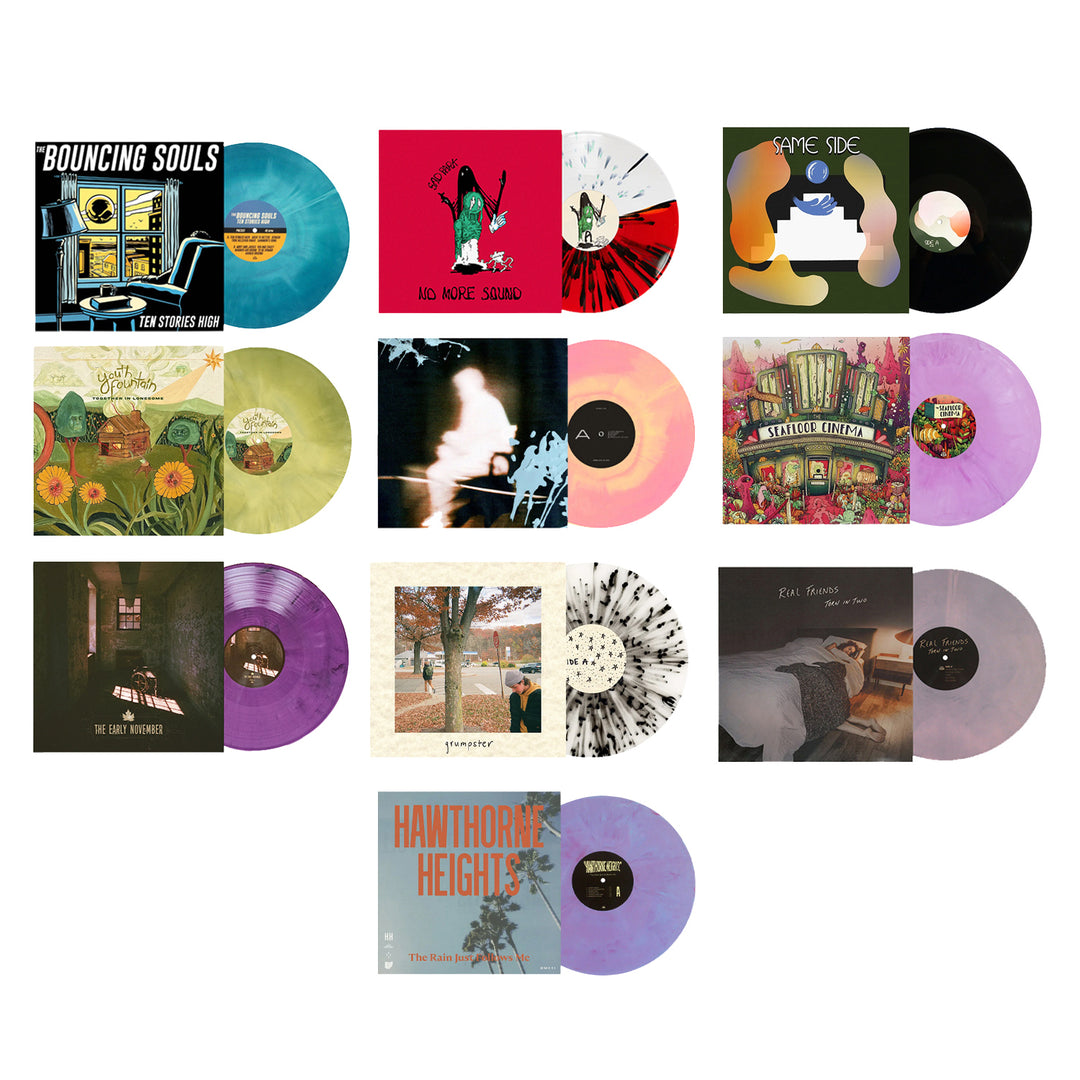 Twelve colored vinyl records, each with unique colorful designs and album covers, arranged in a heart shape on a white background—a striking limited edition vinyl bundle for true collectors.