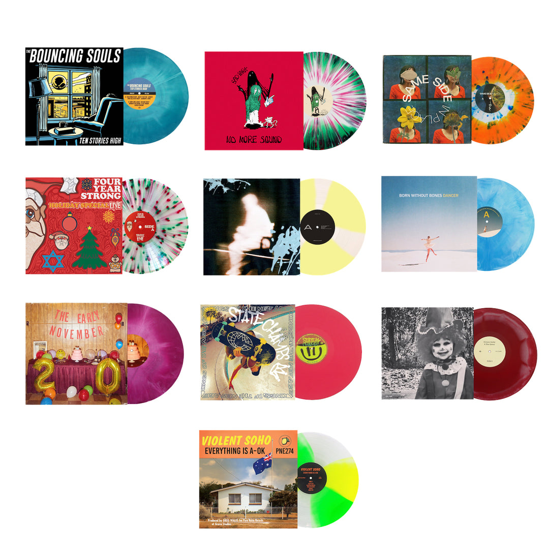 A grid of twelve colorful vinyl records from Pure Noise Records Merch, each a unique colored pressing with distinct multicolored album covers, displayed on a white background.