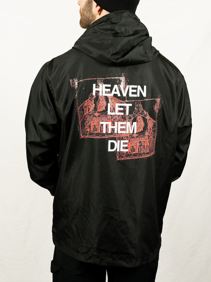 A person wearing a Counterparts black unisex jacket featuring "HEAVEN LET THEM DIE" and red graphic designs on the back, standing against a plain white background.