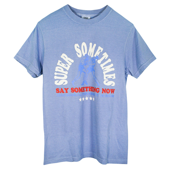 Navy blue t-shirt by Super Sometimes featuring two boxers, “SUPER SOMETIMES” above, and “SAY SOMETHING NOW YOU’RE BURNING ALL YOUR BRIDGES TO THE GROUND” with five stars below the graphic.