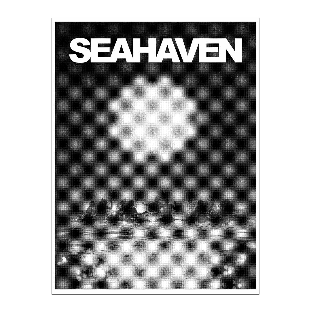 Black and white Seahaven poster featuring a group standing in water at night under a bright light, with reflections—ideal for display or safe storage in a poster tube.
