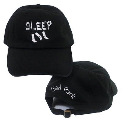 image of the front and back of Sad Park "Sleep" Black dad hat. front has the text Sleep over 3 cigarette butts. back of hat has the text Sad Park over the hole in the back. 
