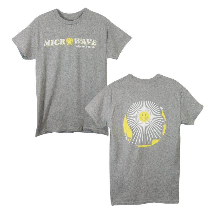 image of the front and back of a heather grey tee shirt on a white background. front is on the left and has a center chest print that says microwave atlanta georgia. back is on the right and has a full back print of the side of a face with white lines and a smiley face in the middle