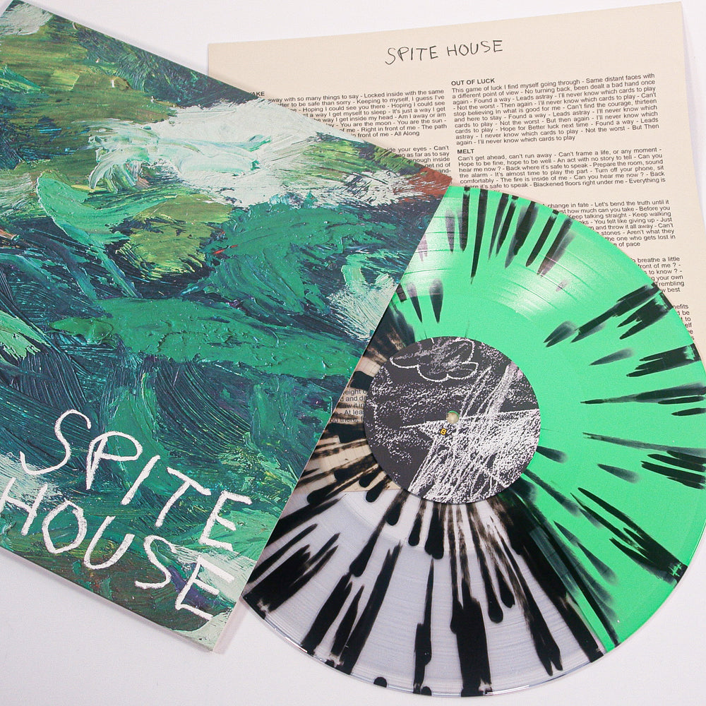 A Spite House Splatter Vinyl LP in green, black, and white rests beside its cover featuring abstract green brushstrokes and Sprite House handwritten below—ideal for any Spite House vinyl collector.