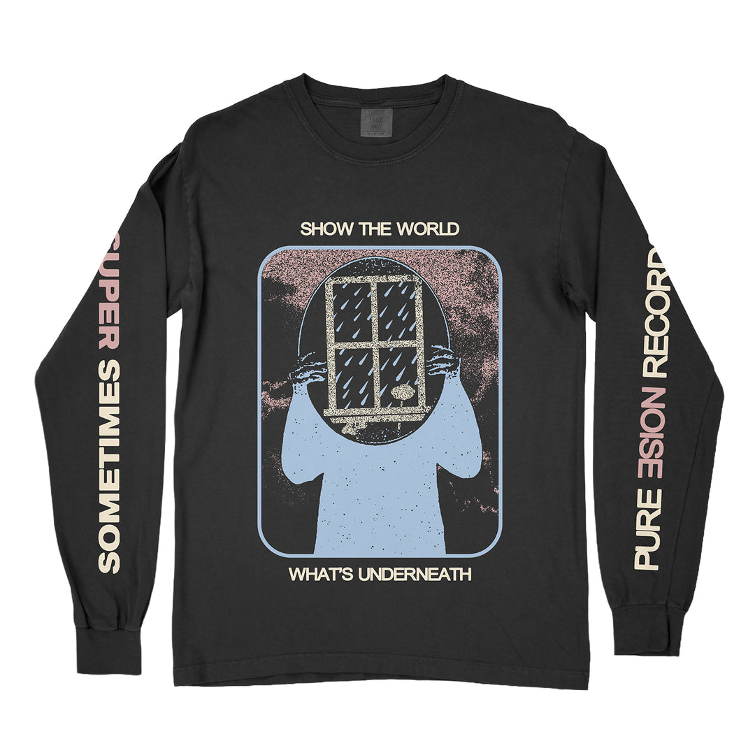 The Super Sometimes black Comfort Colors long-sleeve tee features a graphic of a person holding a window over their face with "SHOW THE WORLD WHATS UNDERNEATH." Sleeve text: "SOMETIMES SUPER" and "PURE VISION RECORDS.