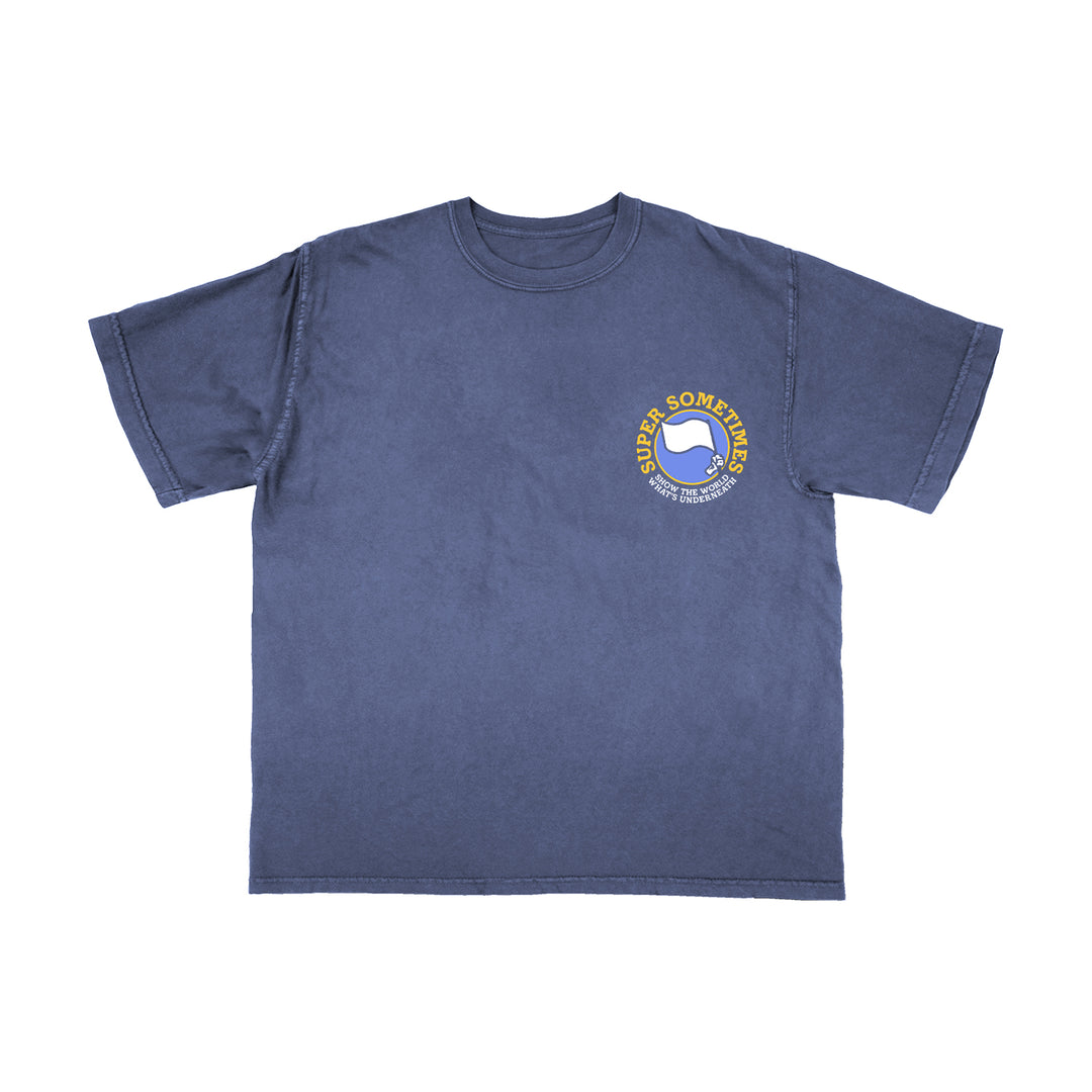A blue Comfort Colors short-sleeve shirt by Super Sometimes featuring a small yellow and white circular chest logo with a thumbs-up graphic and the text “SUPER SOMETIMES.”.