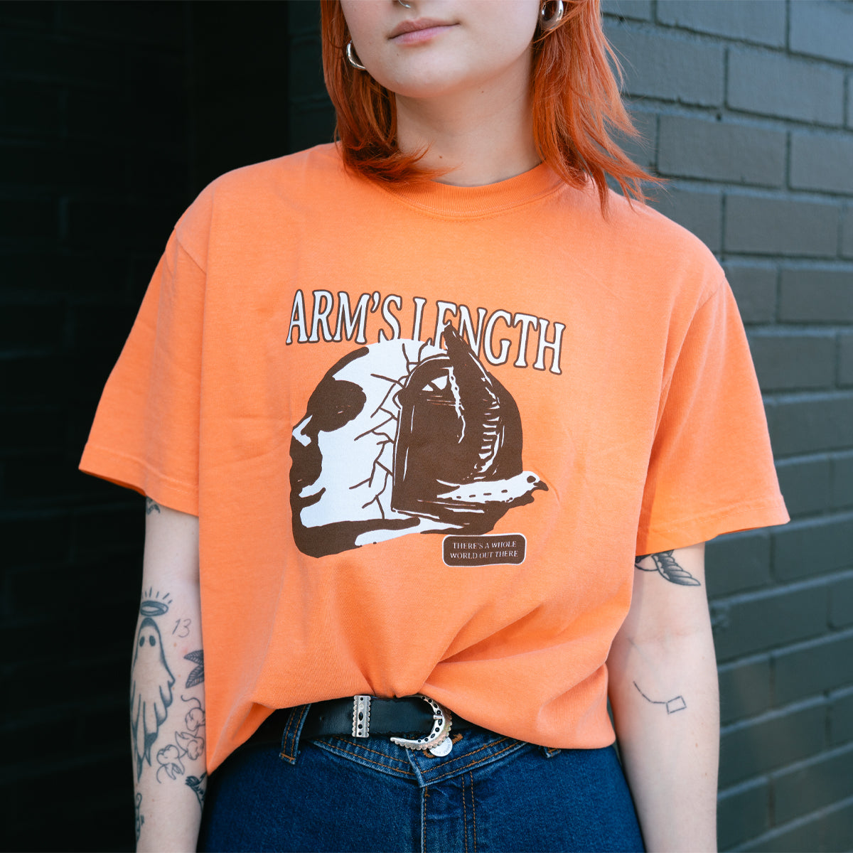 There's A Whole World Out There Orange - Tee – Pure Noise Records