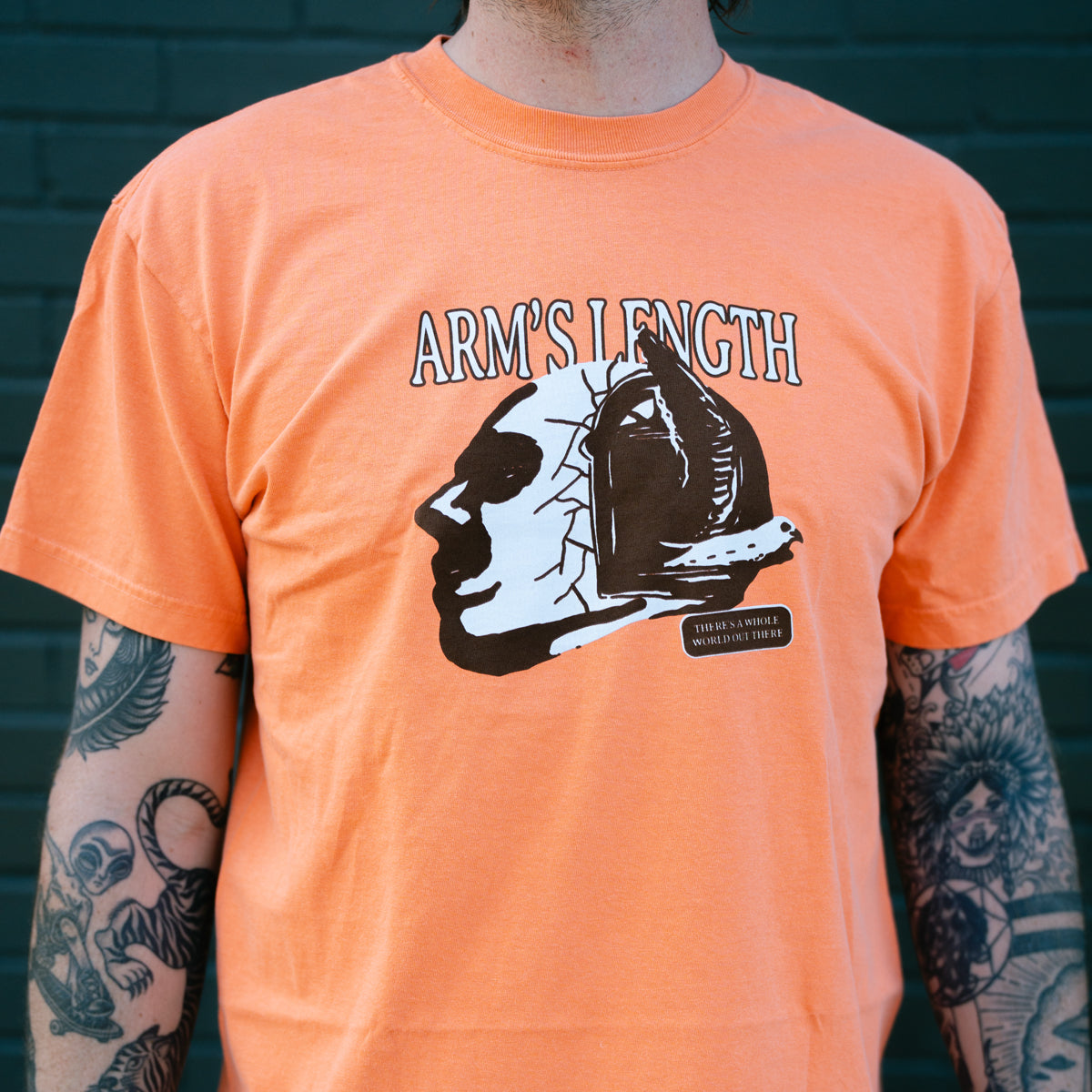 There's A Whole World Out There Orange - Tee – Pure Noise Records
