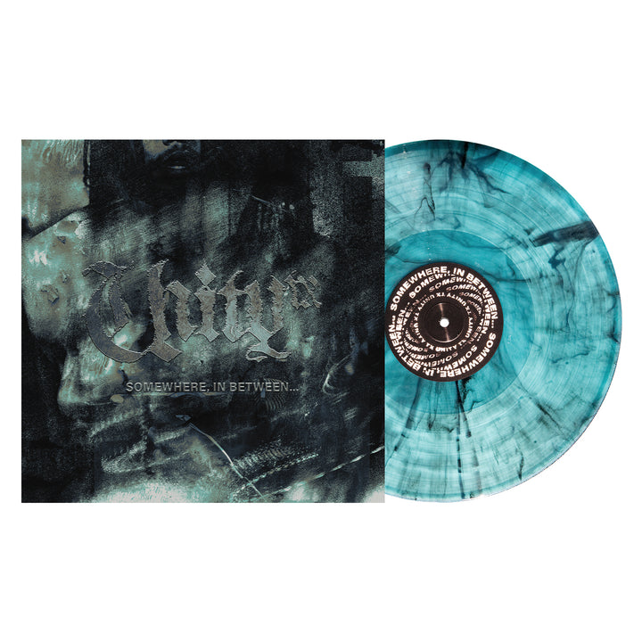 A blue and black Electric Smoke Vinyl LP of UNITYTX's "Somewhere In Between" sits beside an album cover with "Injury" in gothic font on a dark, abstract background—now available for LP Presale.
