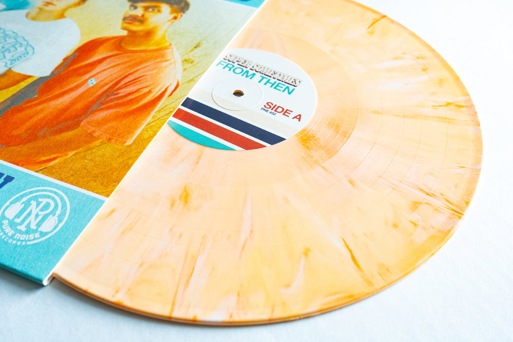 A Super Sometimes Dreamcicle Vinyl LP, partially out of its sleeve featuring a vintage-style photo of two people. The FROM THEN, SIDE A label has colorful stripes—an eye-catching addition to any album presale collection.
