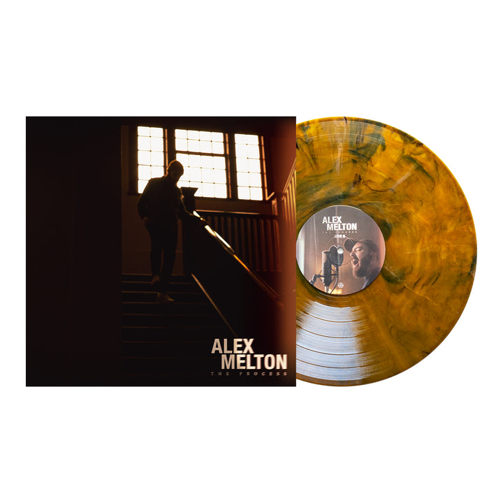 The image shows Alex Melton's The Process LP cover, featuring a person on a dim staircase next to a Tigers Eye Marble Vinyl with a label of a man in headphones—ideal for the album’s presale.
