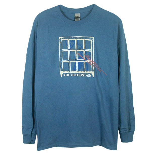 image of an indigo long sleeve tee shirt on a white background. front print of a window. at the bottom says youth fountain