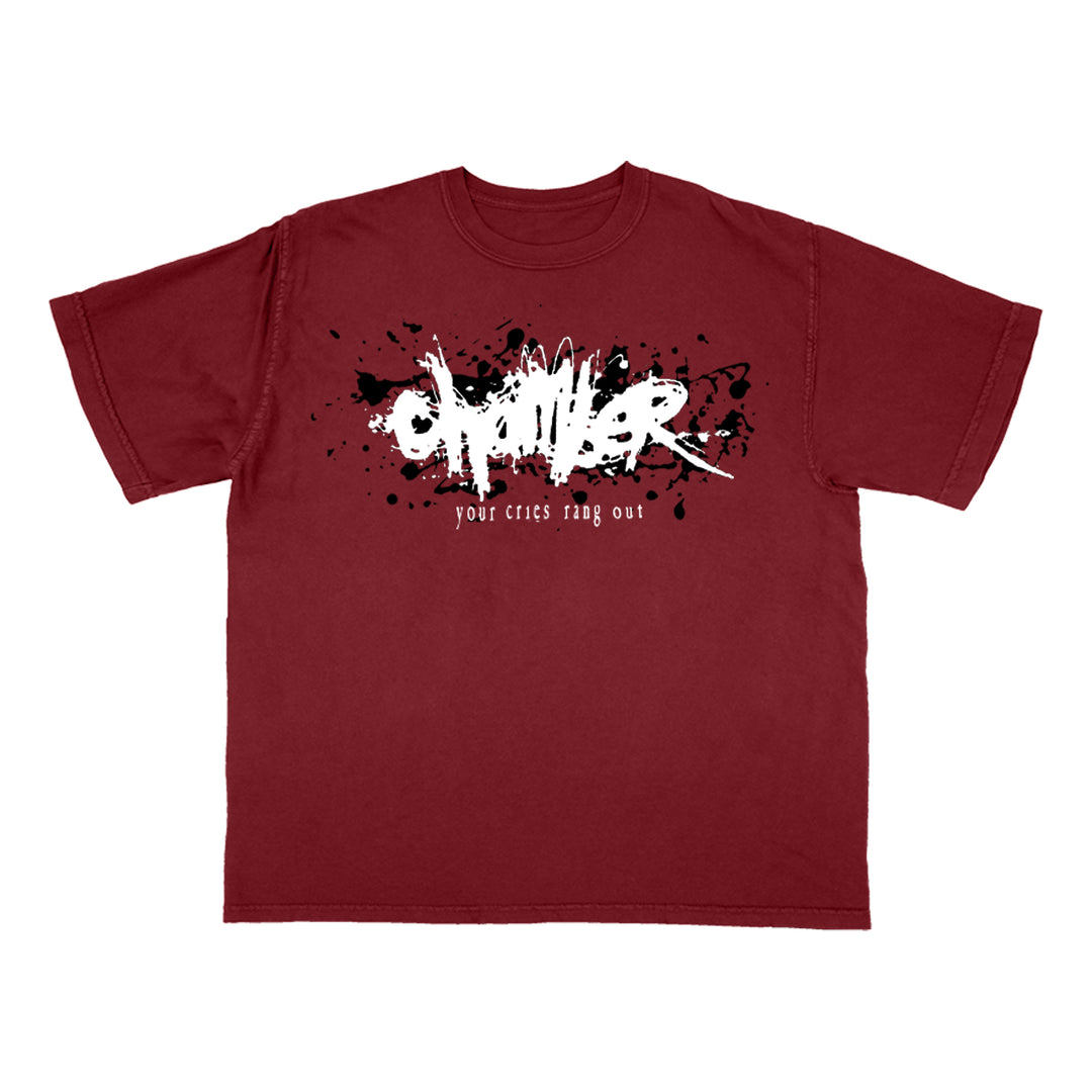 A Chamber Comfort Colors maroon shirt features a black paint splatter design with bold white graffiti-style "OMEN" text and smaller text below that reads "your cries ring out.