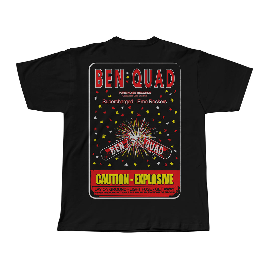 Black Ben Quad M80 t-shirt with a colorful firework label graphic, stars, and fireworks in red, yellow, and white. Features Ben Quad, Supercharged - Emo Rockers, and Caution - Explosive text with warning details.