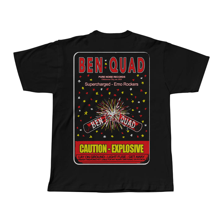Black Ben Quad M80 t-shirt with a colorful firework label graphic, stars, and fireworks in red, yellow, and white. Features Ben Quad, Supercharged - Emo Rockers, and Caution - Explosive text with warning details.