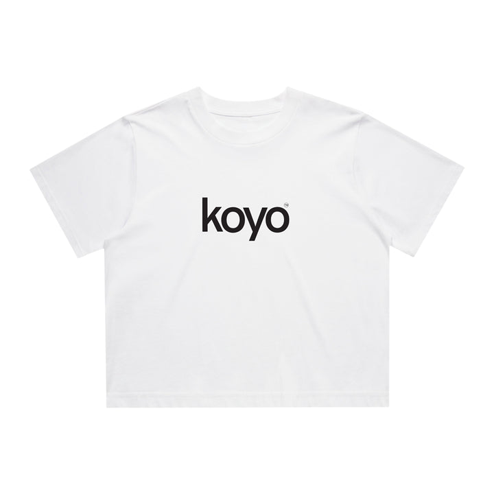 A plain white KOYO crop top featuring "koyo" in bold black lowercase letters across the chest, perfect for someone from Long Island. Displayed on a clean white background.