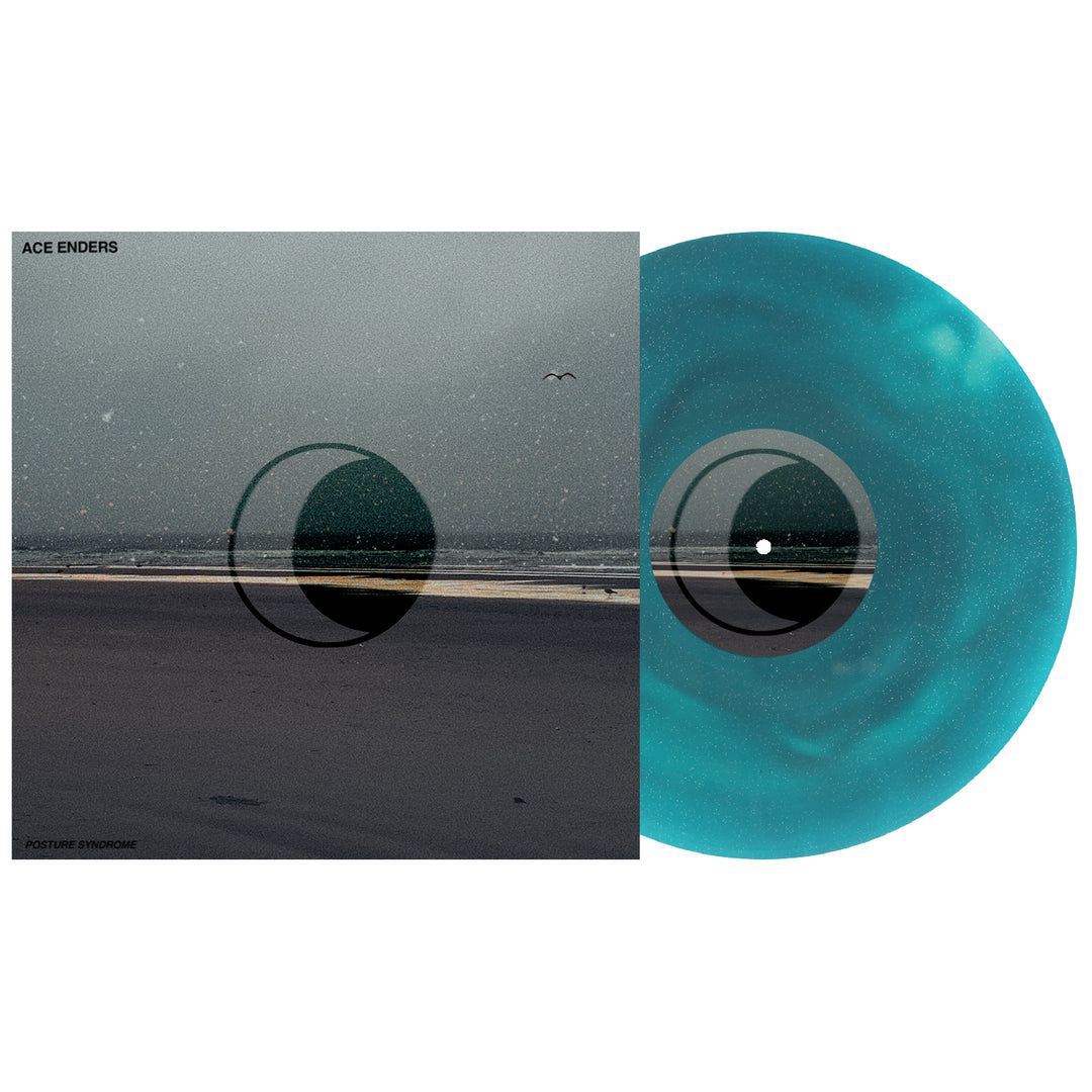 A turquoise marbled vinyl from Ace Enders' Posture Syndrome album partly covers misty beach cover art. A geometric black circle overlaps both the record and artwork, while small birds soar above the shoreline.