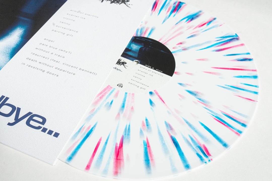 A Chamber White with Magenta & Blue Dot Splatter Vinyl LP is partially pulled from its sleeve, displaying the tracklist for "This Is Goodbye" in black on the inner sleeve.