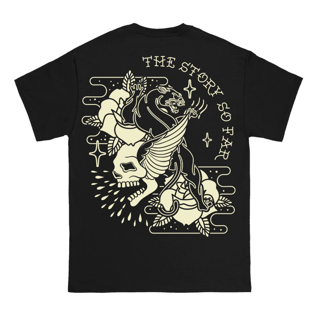 The Story So Far black Comfort Colors t-shirt features an illustrated panther, winged skull, roses, and stars, with THE STORY SO FAR arching above the artwork in bold retro-style lettering.