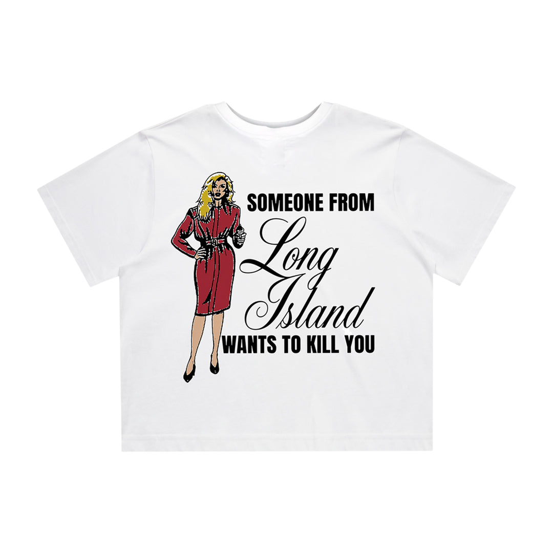 KOYO white crop top with a graphic of a blonde woman in a red dress and heels. Features bold text: “Someone From Long Island wants to kill you.”.