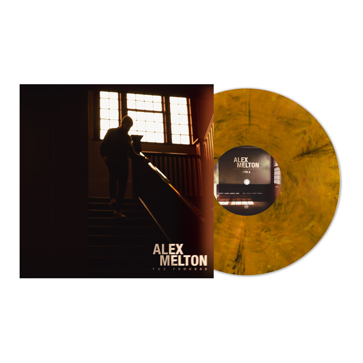 The Alex Melton "The Process" Tigers Eye Marble Vinyl is available for presale, featuring an album cover with a person on a staircase before large windows.