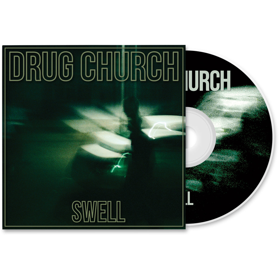 The image displays a Drug Church "Swell" CD and its cover, featuring a blurry, dark green photo of a person next to a car at night, with bold lettering for the band's name and album title.