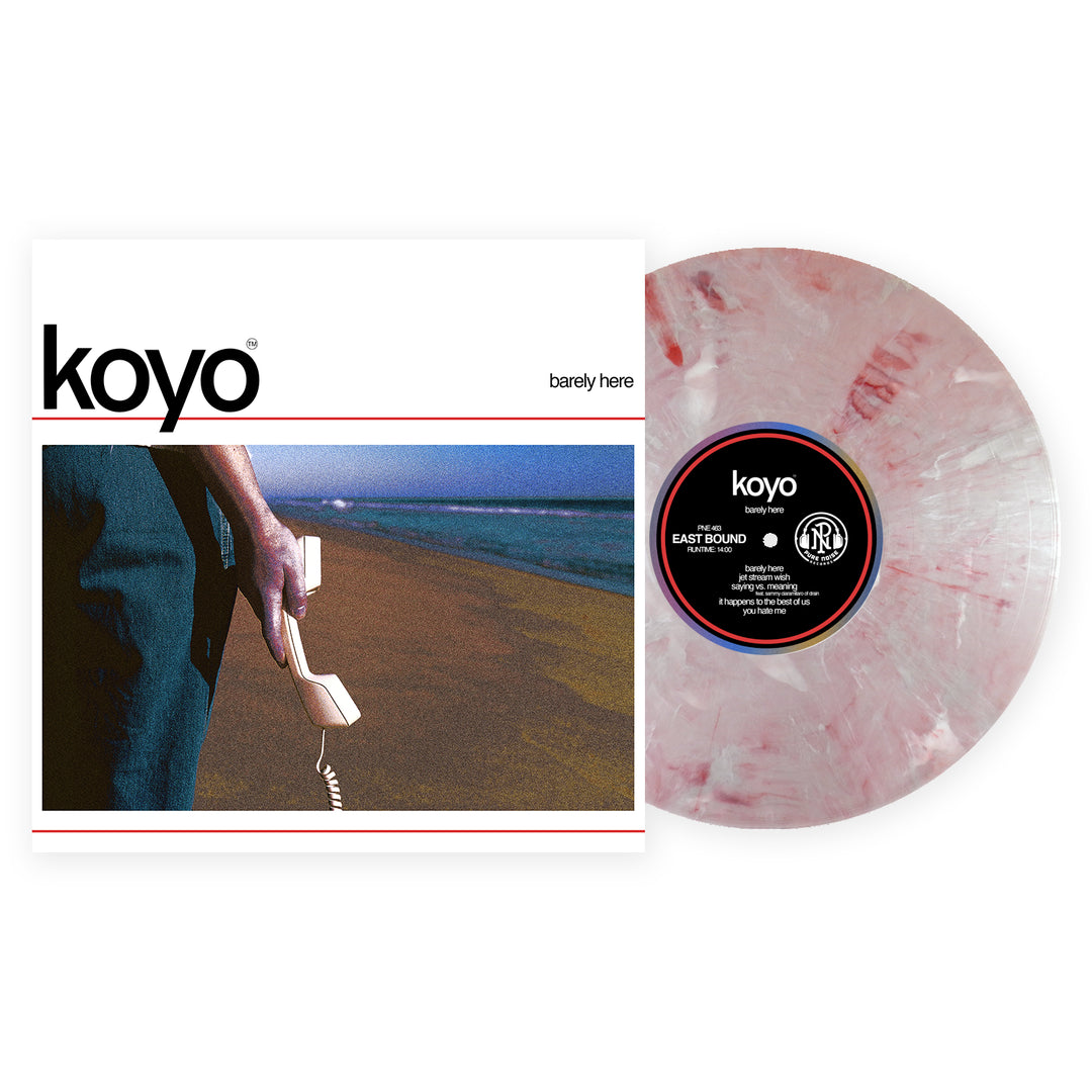A marbled pink and white KOYO Centurion Marble Vinyl LP slides from its cover, featuring a person with a landline phone on a deserted beach. The album, koyo: barely here, is now available for presale.