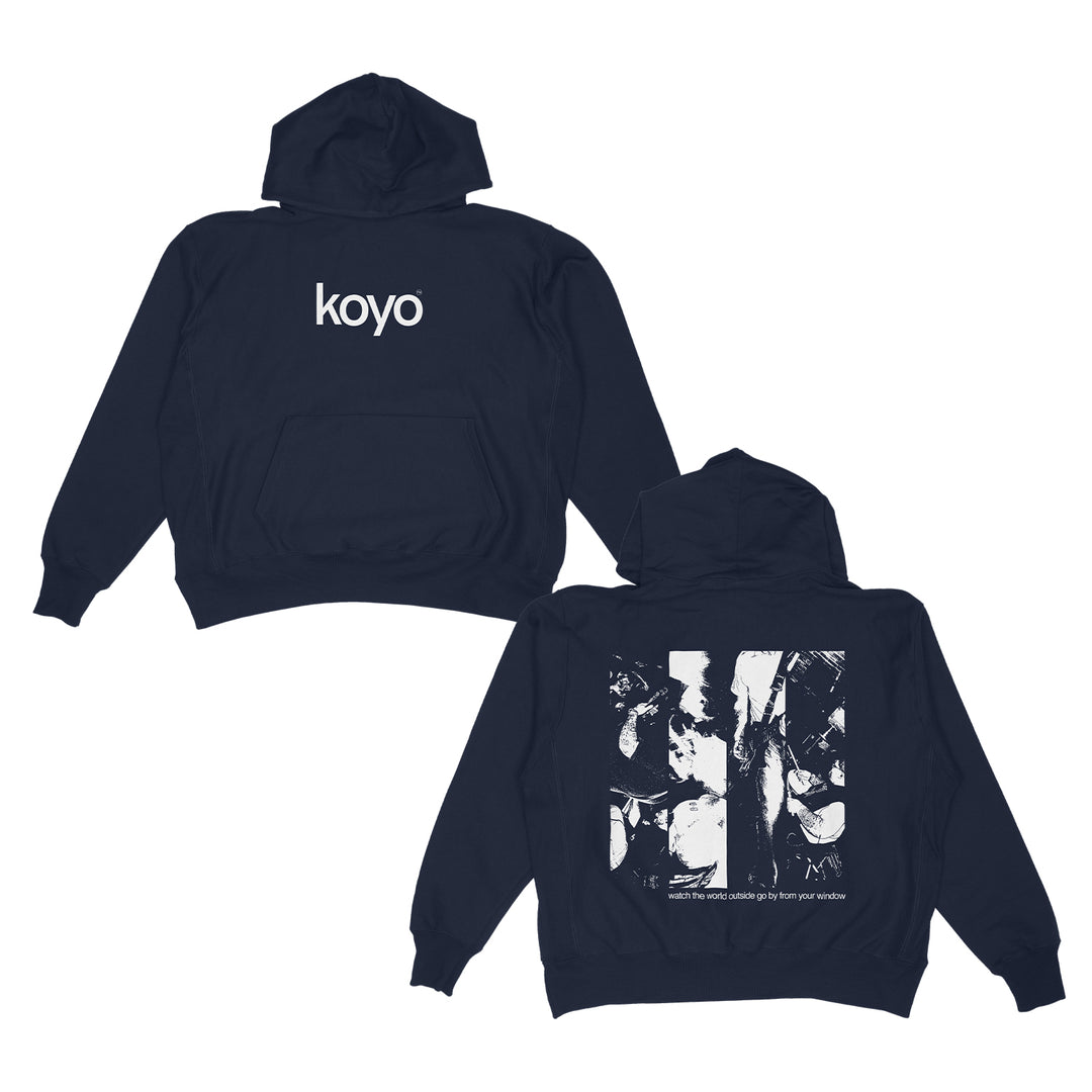 A KOYO black hoodie shown front and back; the front displays "koyo" in white, while the back has an abstract black-and-white World Navy-inspired graphic with small white text underneath.