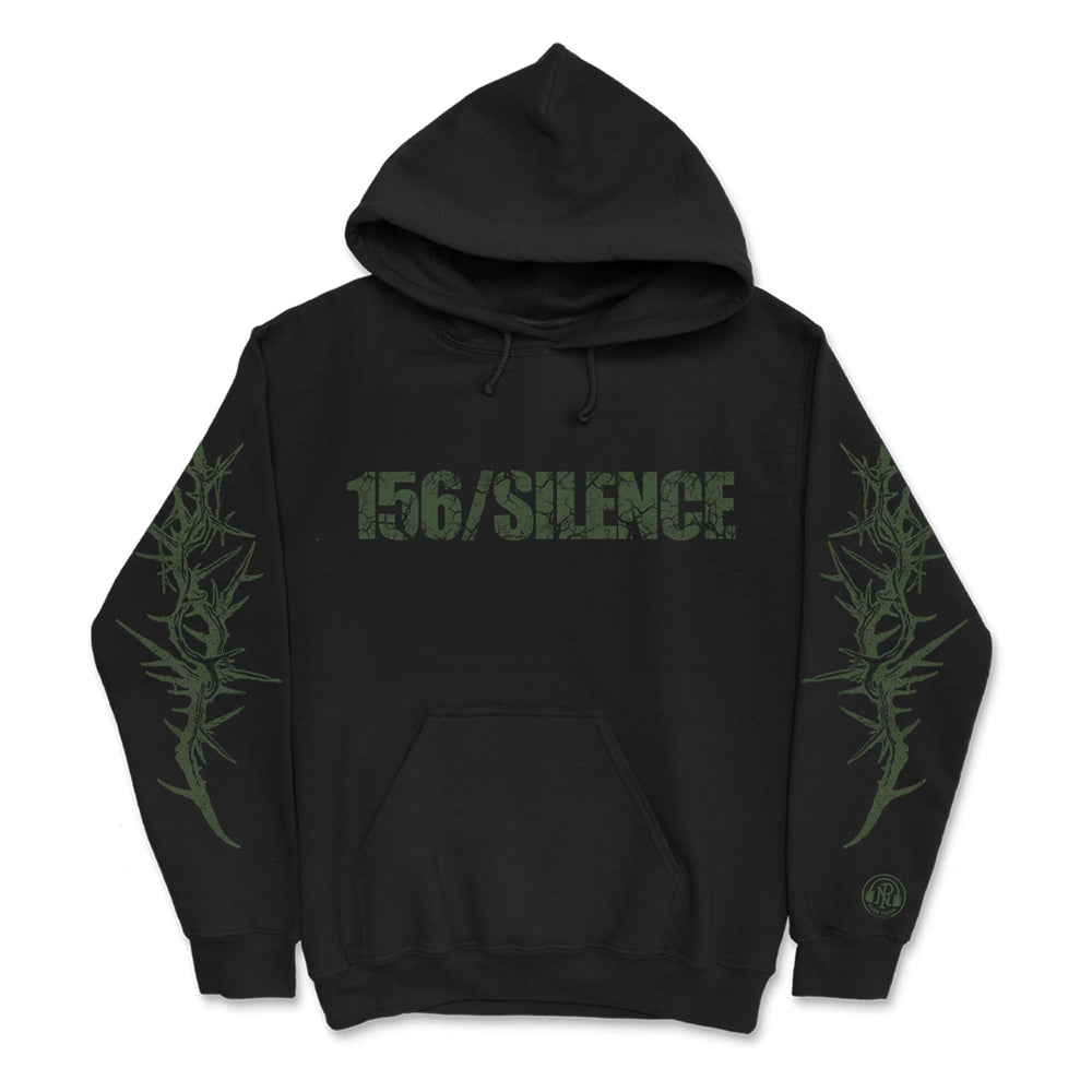 Black hoodie by 156/Silence with distressed green 156/SILENCE text on the chest, abstract green thorn designs on both sleeves, and a small round logo near the left wrist.