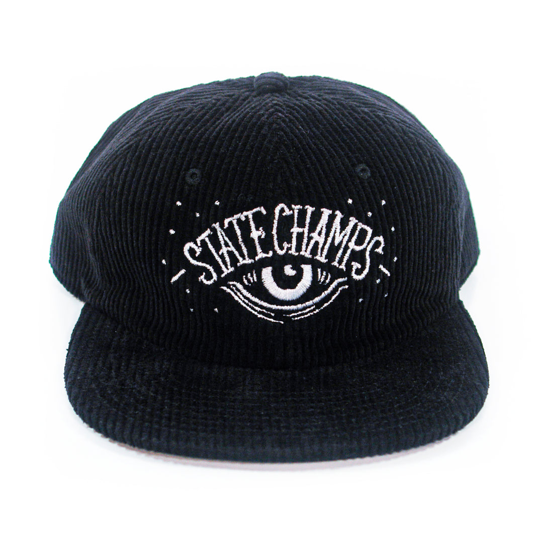 The State Champs Eye Black Dad Hat is black corduroy with an embroidered eye and rays graphic plus "State Champs" in white on the front.