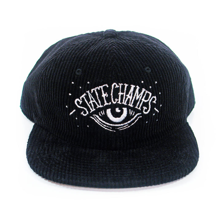 The State Champs Eye Black Dad Hat is black corduroy with an embroidered eye and rays graphic plus "State Champs" in white on the front.