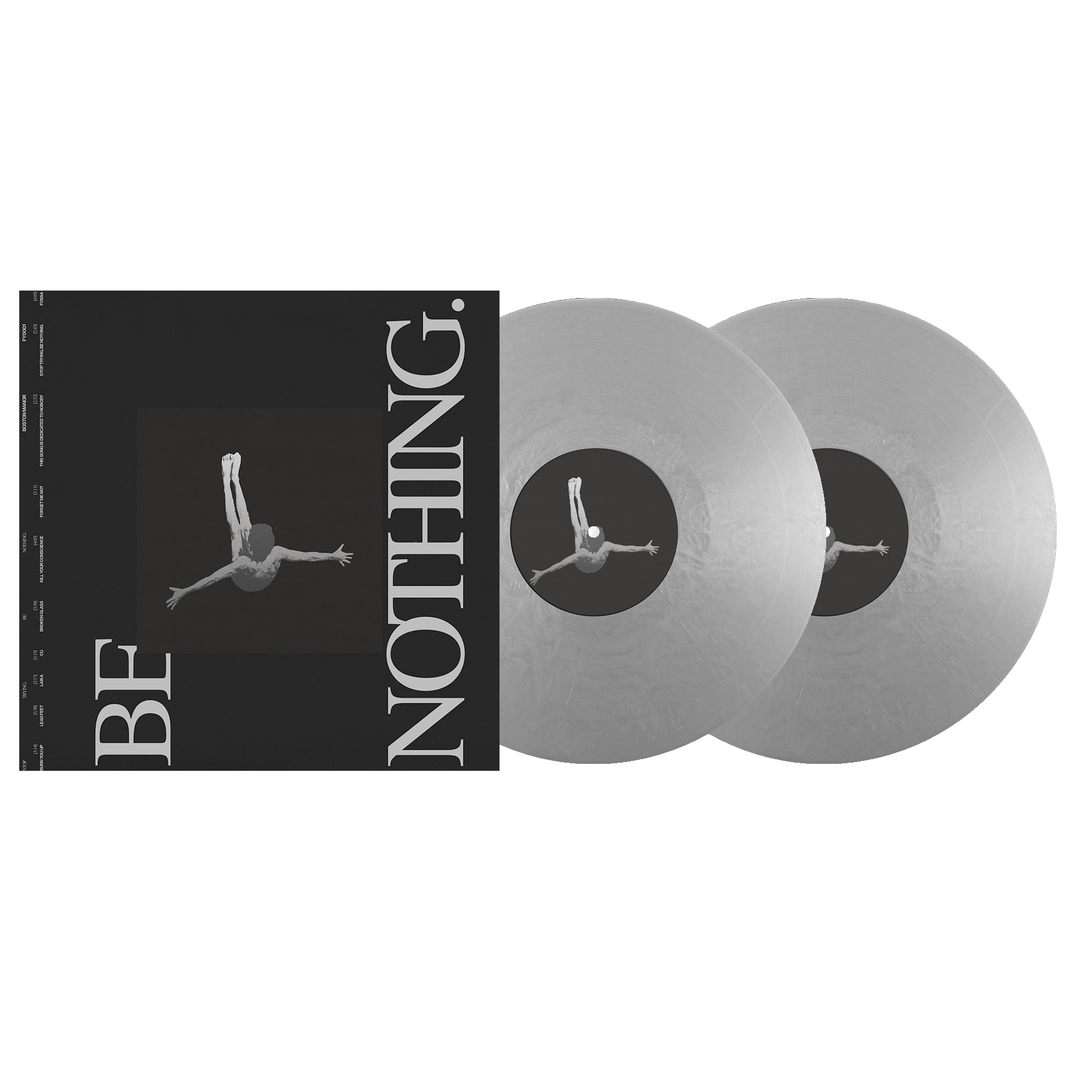 Two silver vinyl records are beside a black album cover with a grayscale image of a person falling backward and "BE NOTHING." in bold white letters, marking the Boston Manor Be Nothing 10 Year vinyl release by Boston Manor.
