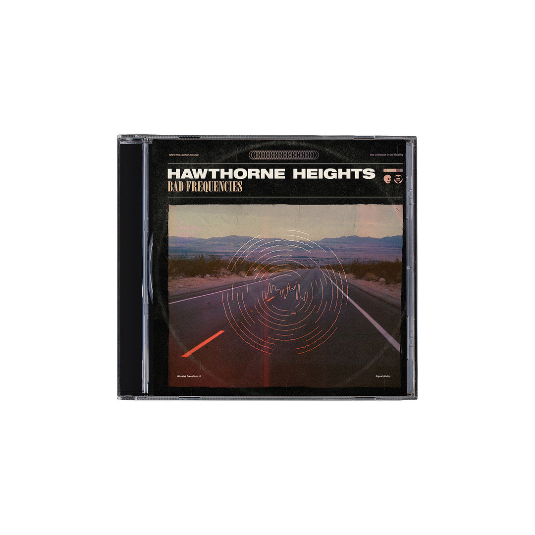 This Hawthorne Heights CD features a desert highway, distant mountains, and red soundwave graphics on the case, with the full Bad Frequencies album tracklist included inside.