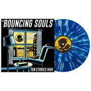 The Bouncing Souls Ten Stories High Vinyl LP. Album Art depicts a person sitting by the window looking out to see a large Bouncing Souls symbol floating in the sky. LP is exposed to show color. Color of LP is Blue with Heavy White Splatter.