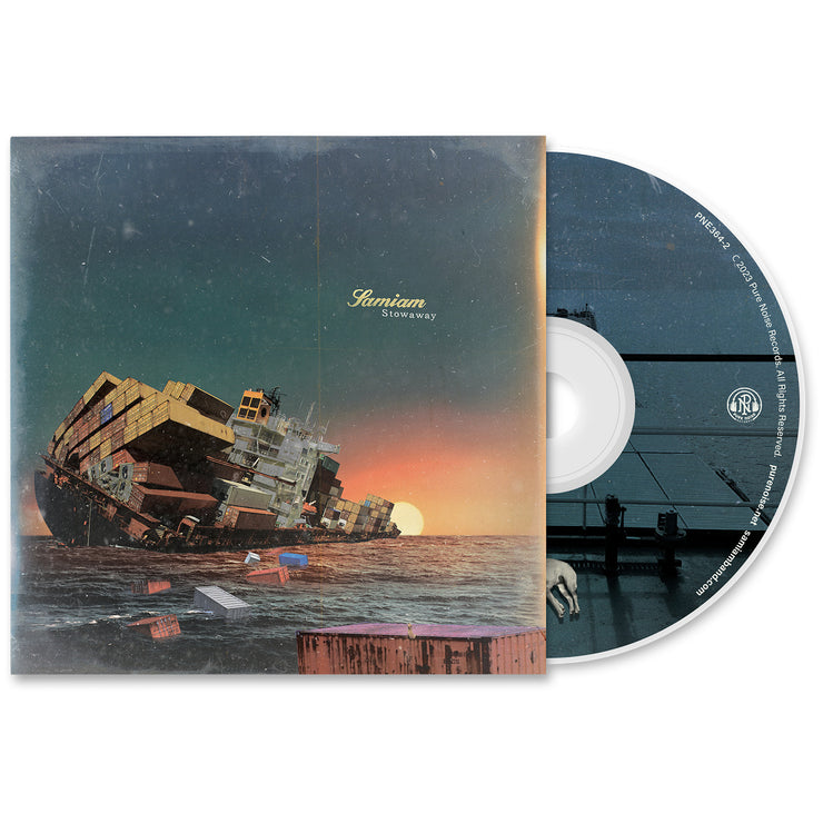 Samiam Stowaway CD. CD exposed to show art on disc. are on disc looks to represent the deck of boat with shipping containers sinking. Album Art shows a large boat with shipping containers sinking at sunset. 