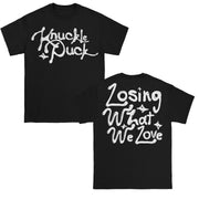 Knuckle Puck Losing What We Love Black T-Shirt. front of shirt has the text Knuckle Puck in cursive font and white ink. back of shirt has Losing What We Love text in the same cursive and white ink.