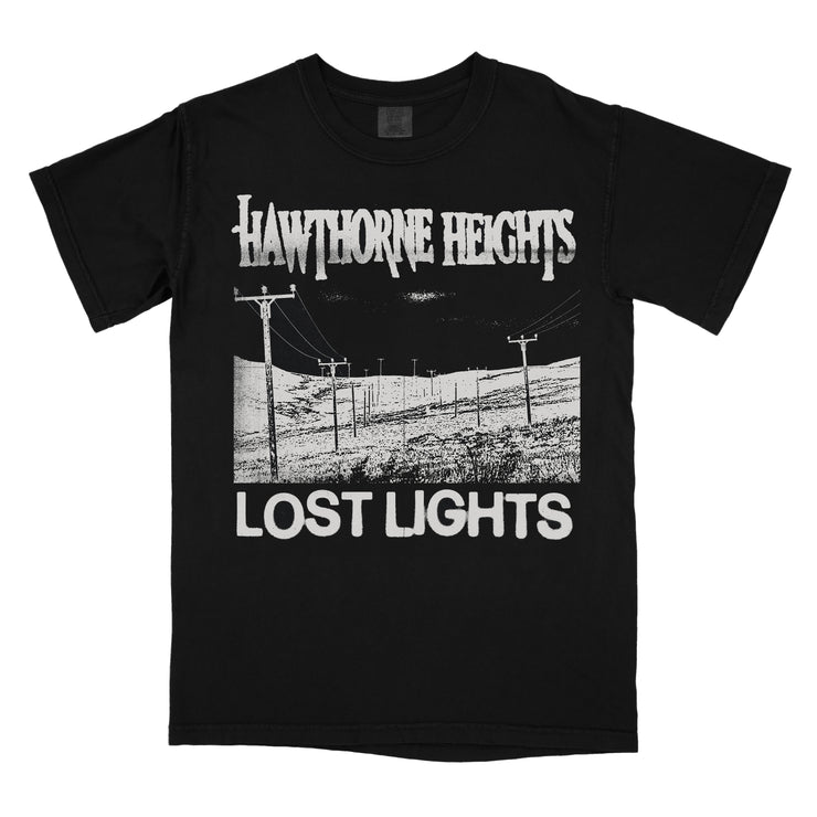 Hawthorne Heights Lost Black T-Shirt. front chest of hoodie has a valley with telephone poles going through it. above the image says Hawthorne Heights in their classic font. under the image says Lost Lights all of this is in white ink.