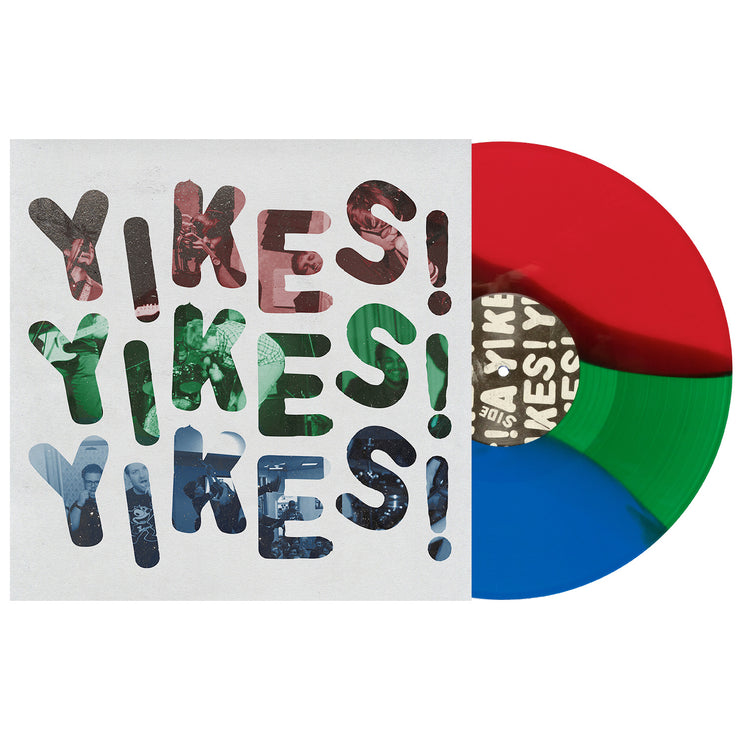 Dollar Signs YIKES vinyl LP, with the vinyl exposed to show color. Album art is the text YIKES! repeated 3 times in red, green, then blue with a white background. color of vinyl is red, green, blue tri stripe.