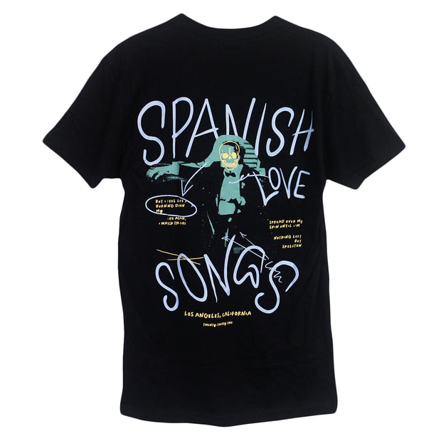 black tee on white background that has full print with three colors. purple ink says spanish love songs. green ink displays body of a man with a skeleton face with yellow ink that has song lyrics.