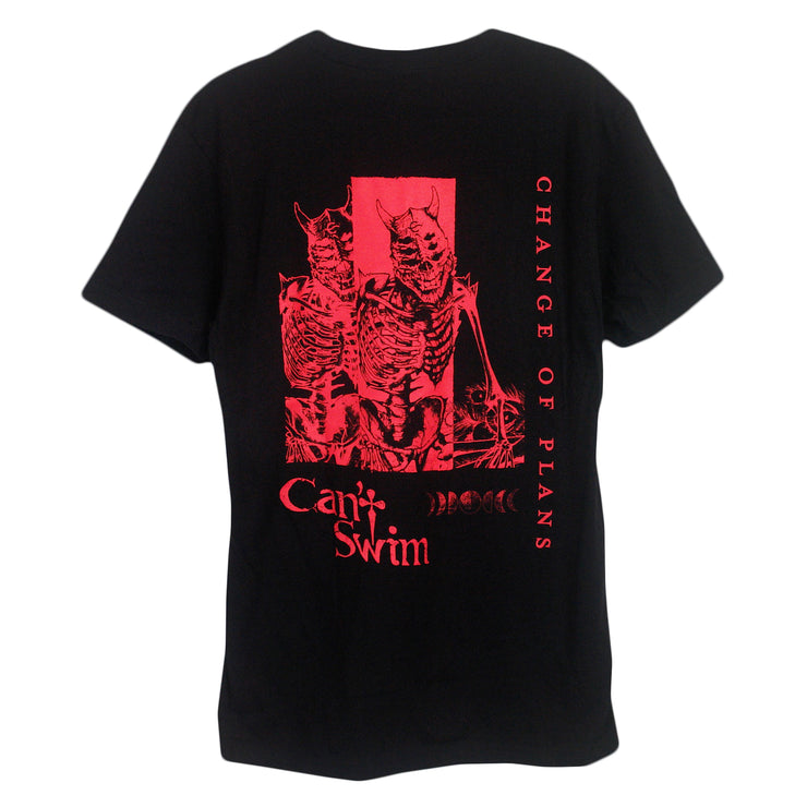 image of the back of a black tee shirt on a white background. the tee has a full print in red of two skeleton demons and change of plans written vertically on the right and can't swim on the bottom left of the shirt