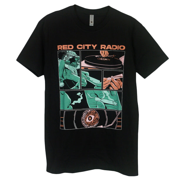 image of the front of a black tee shirt on a white background. tee has full chest print. at the top in orange says red city radio, and below is a comic book like image of someone listening to a vinyl record and rolling a joint.