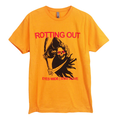 image of a gold tee shirt on a white background. front of the tee has front and center chest print. a black grim reaper is in the center, holding a skull head with two red X's on the eyes. above that in red says rotting out, and below says eyes wide stay alive