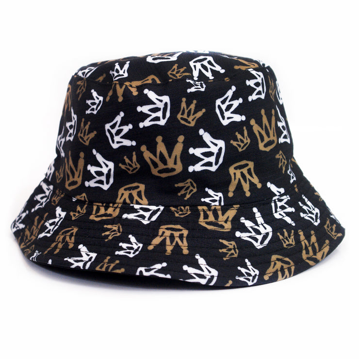 image of a black bucket hat with white and gold graffiti crowns all over on a white background.