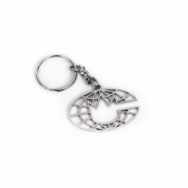image of a silver keychain on a white background, keychain has silver ring, with six chain links attached to a cut out silver globe like image with a crown in the center. It's the logo for State Champs New Age King Album
