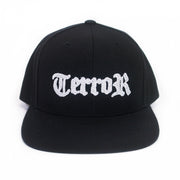 image of the front of a black snapback hat on a white background. the hat has white embroidery across the front that says TERROR