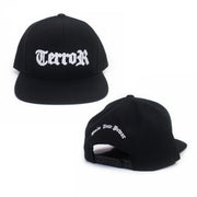 image of the front and back of a black snapback hat on a white background. the front of the hat is on the left and has white embroidery across the front that says TERROR. the back of the hat is on the right and has arched white embroidery above the back snap area that says pain into power.