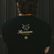 image of the back of a man wearing a black tee shirt. back of tee has pure noise and Samiam Logo by the top center of the tee.