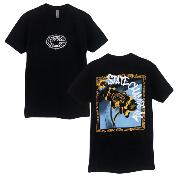 image of the front and back of a black tee shirt on a white background. the front of the tee is on the left and has a small white print in center of the chest of an outline of the world with barbed wire around it. the back of the tee is on the right and has a full back print of a yellow and black guy on a skateboard in an empty pool in blue with a yellow sqaure border around it that says kings of the new age