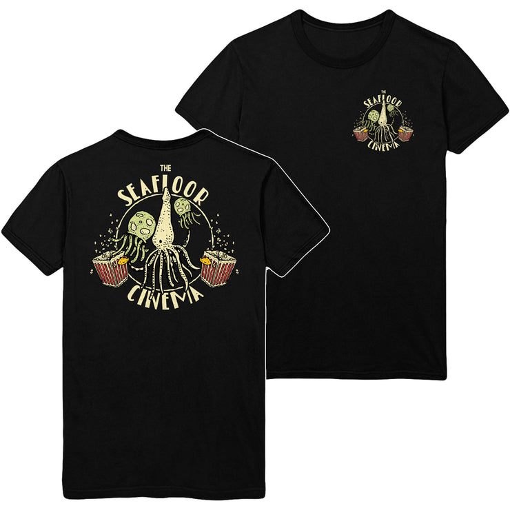 The Seafloor Cinema self titled Black t-shirt. front print of shirt is a left chest print of a squid and two jellyfish with popcorn. the back of shirt has the same print just larger and covering the whole back. 